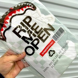 Sprayground white camo clutch.